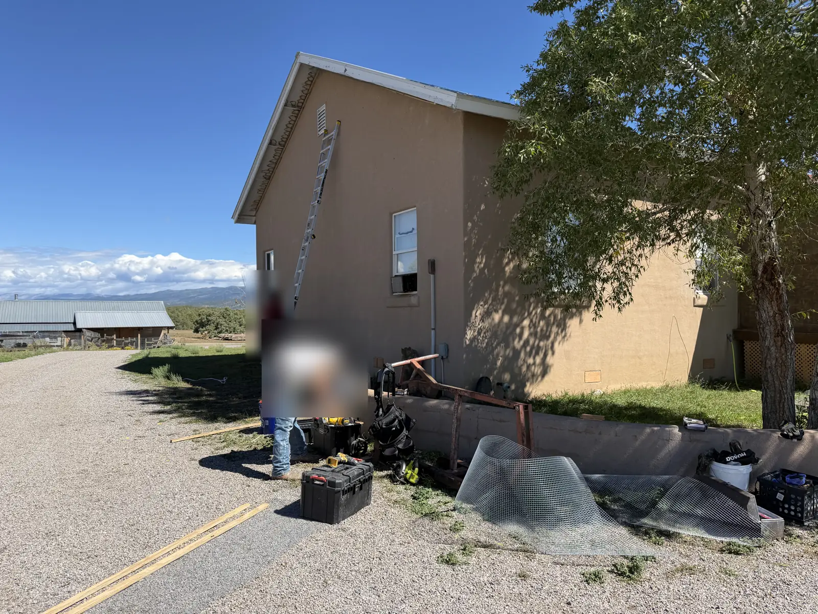 Crew bagging debris outside a home during a wildlife cleanup job